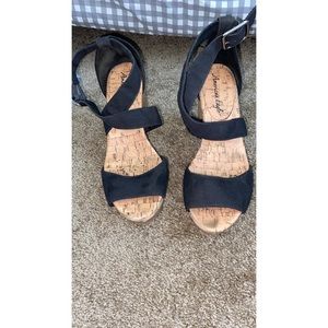 Black wooden platform sandal heel